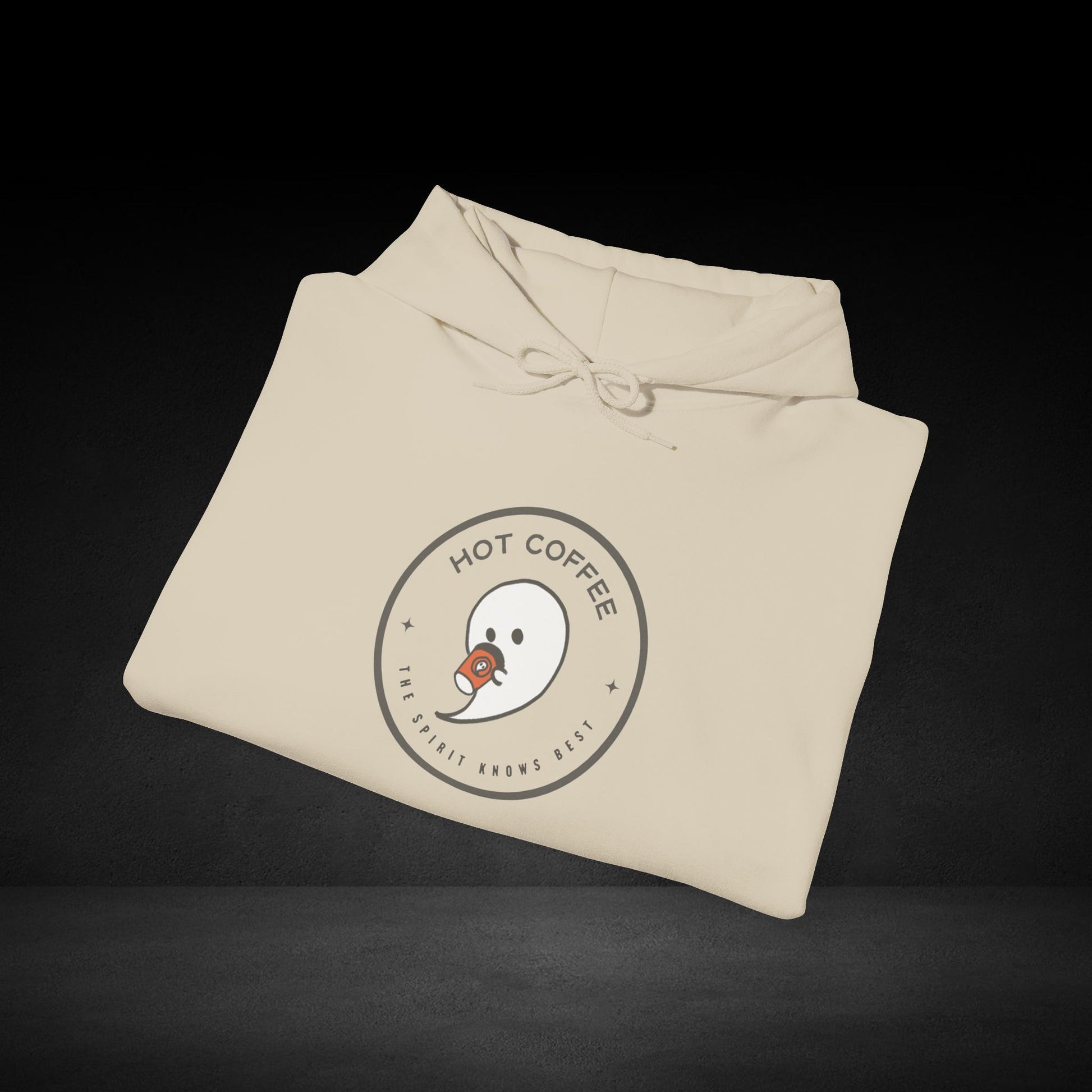 A beige hoodie with a circular logo that says "HOT COFFEE" and "THE SPIRIT KNOWS BEST" printed on it.