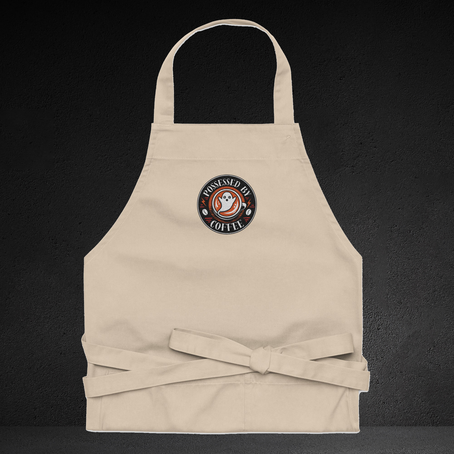 A beige apricot with a circular logo on the front, featuring a ghost and the text "COFFEE".
