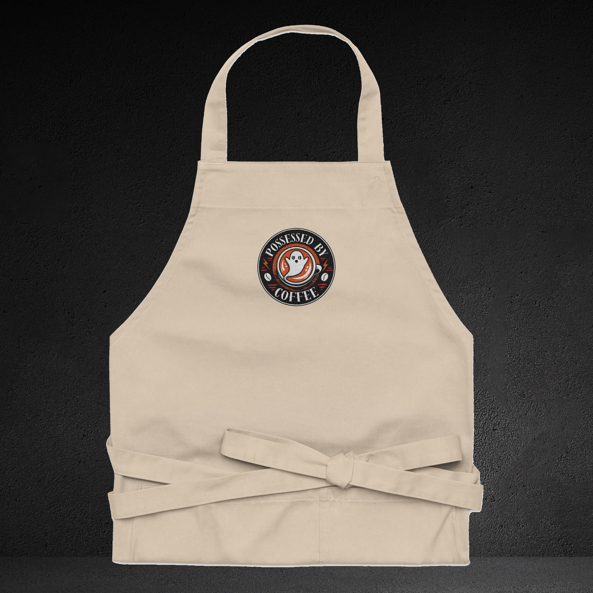 A beige apricot with a circular logo on the front, featuring a ghost and the text "COFFEE".