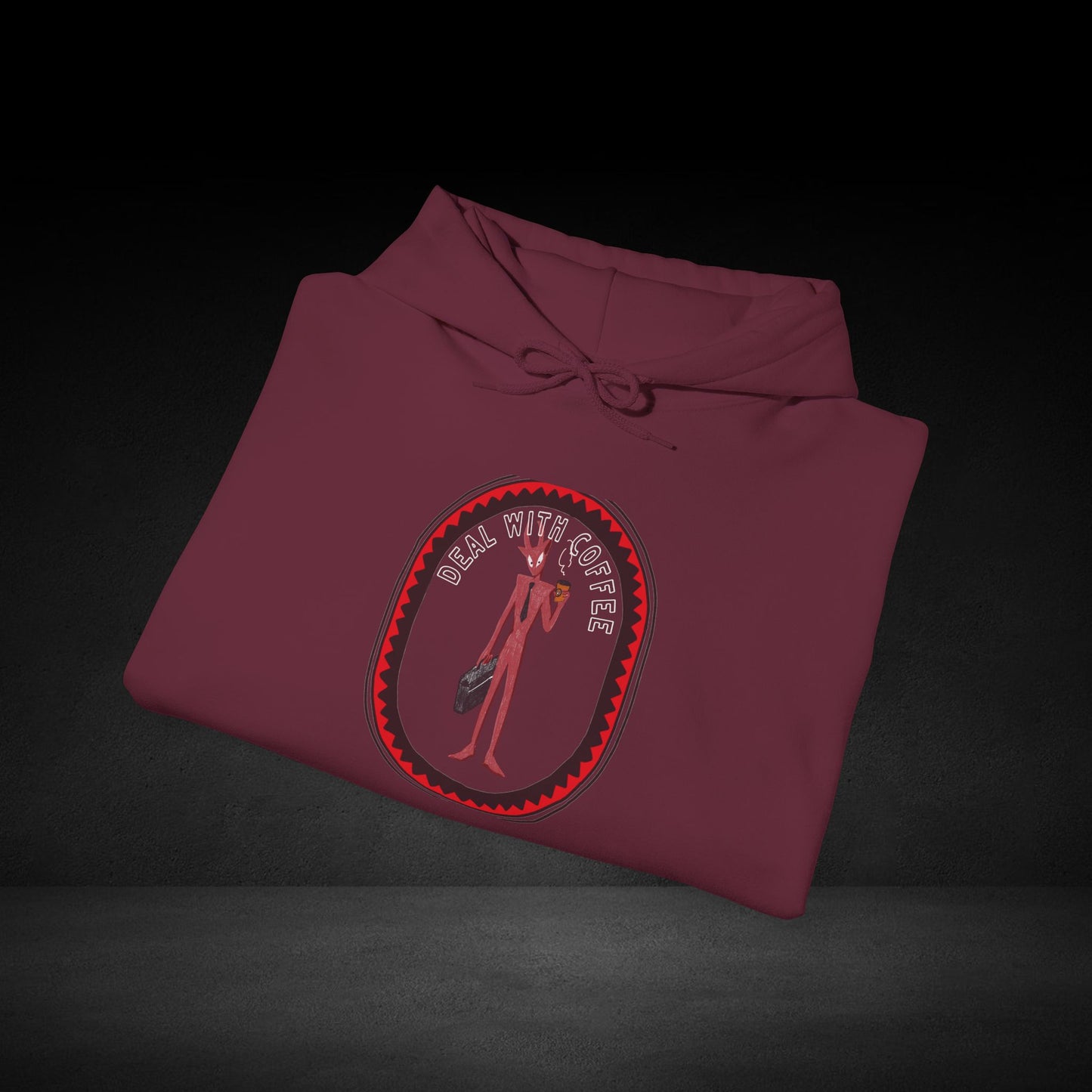 A maroon hoodie with a graphic design on the front, featuring a stylized figure holding a weapon.
