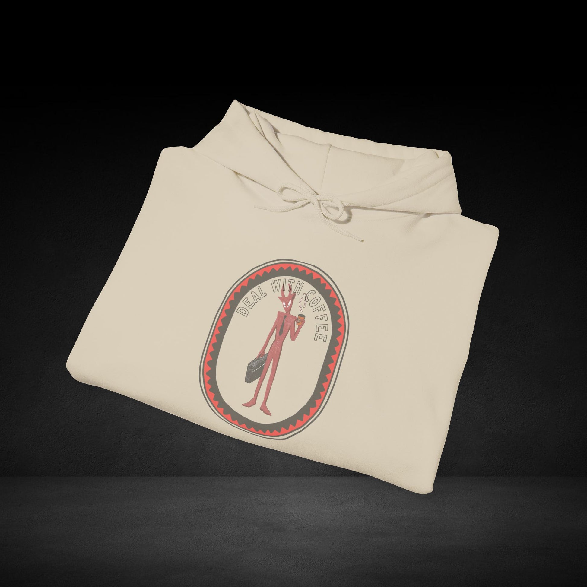 A white hoodie with a graphic design on it, featuring a red and black circular emblem with a figure inside.