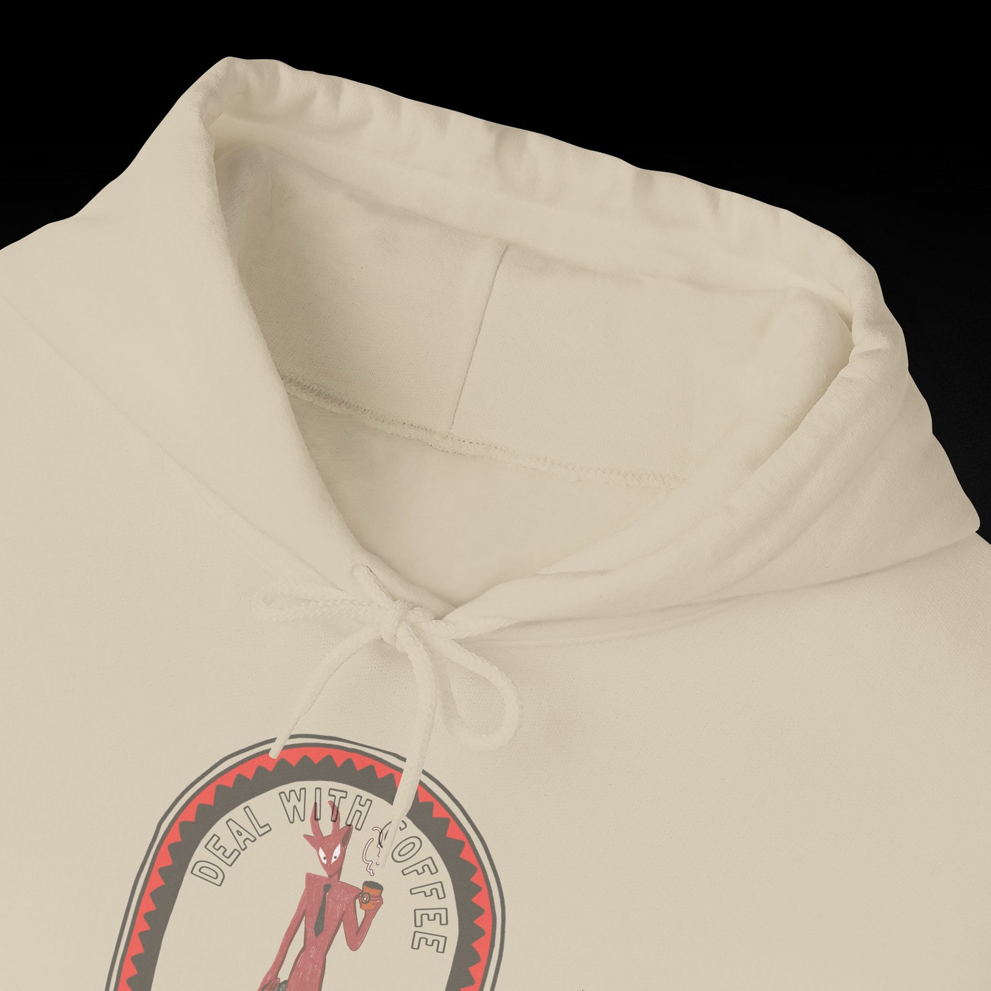 A white hoodie with a graphic design featuring a cartoon character and the text " Deal with coffee".